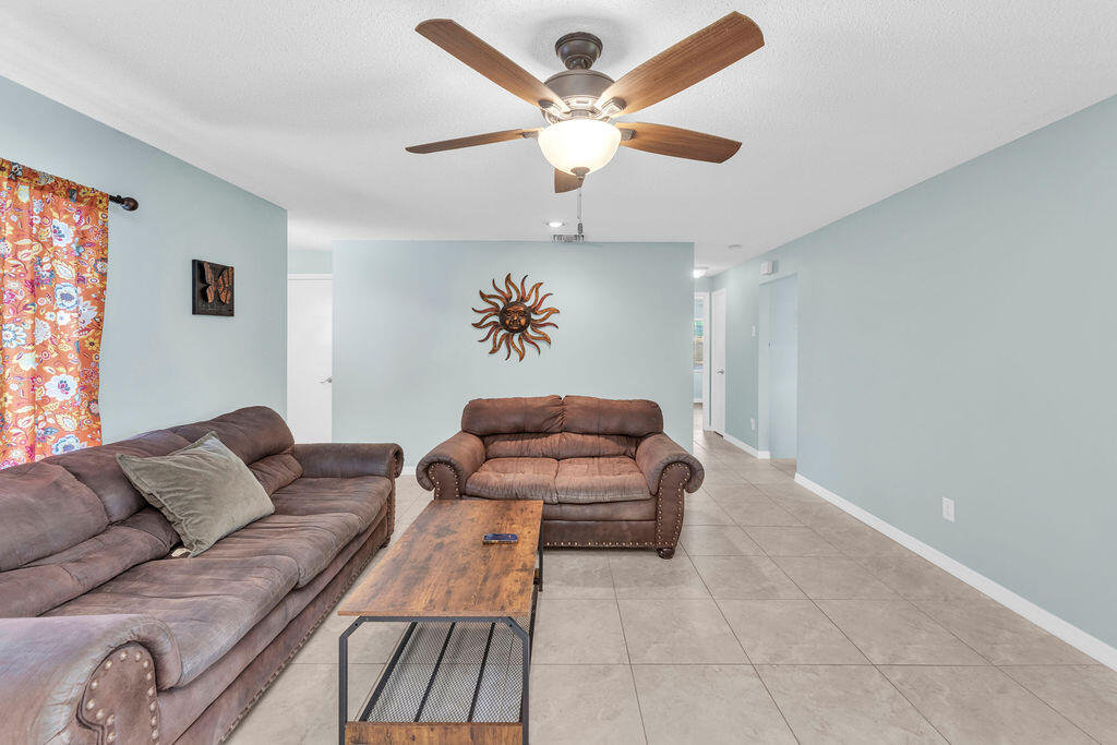 2402 Southeast Pinero Road Port St. Lucie, FL 34952 - Photo 31 of 45 a living room with furniture