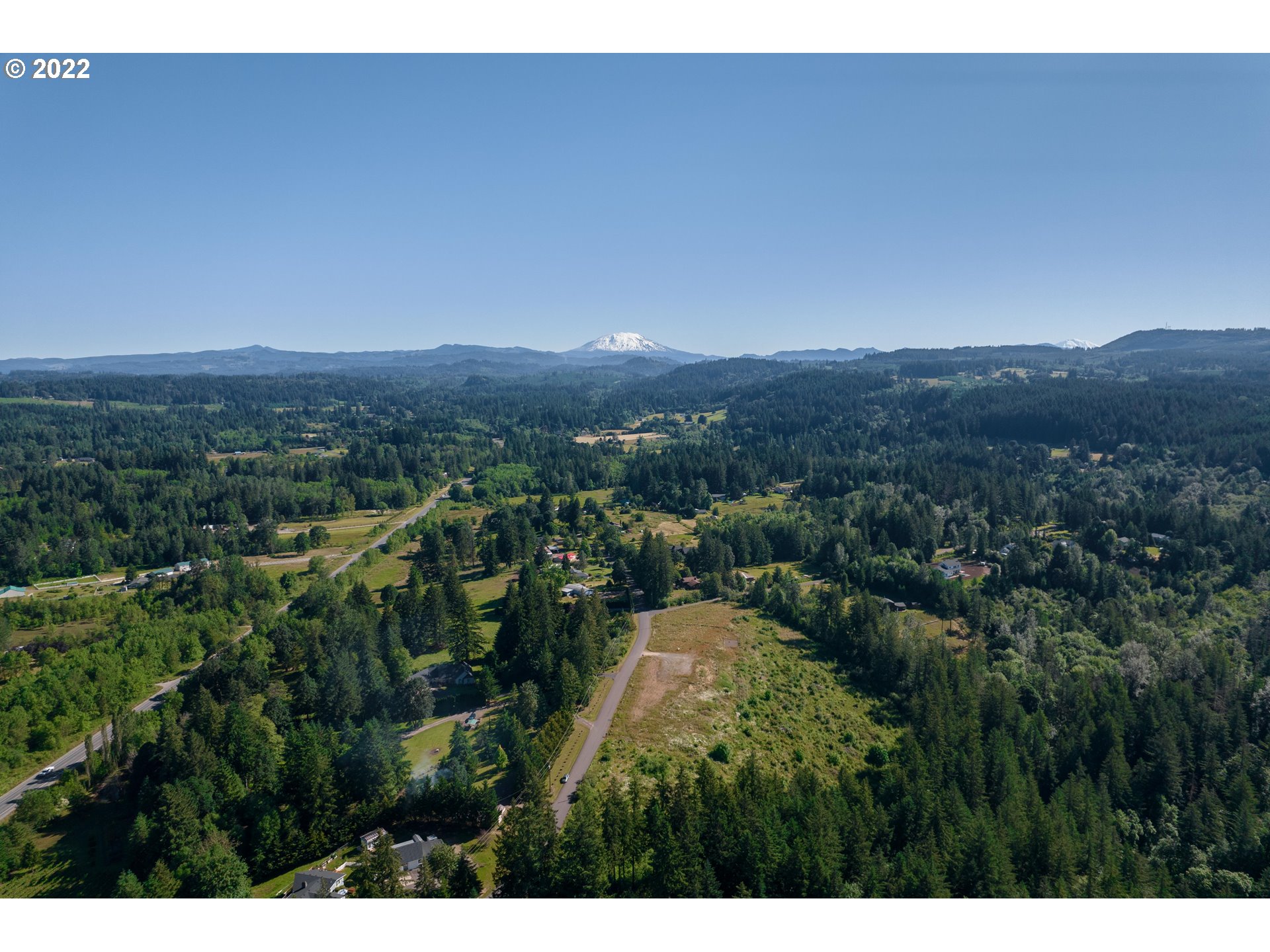 30007 Northeast Mc Bride Road Battle Ground, WA 98604 - Photo 1 of 7 a view of a city with lush green forest