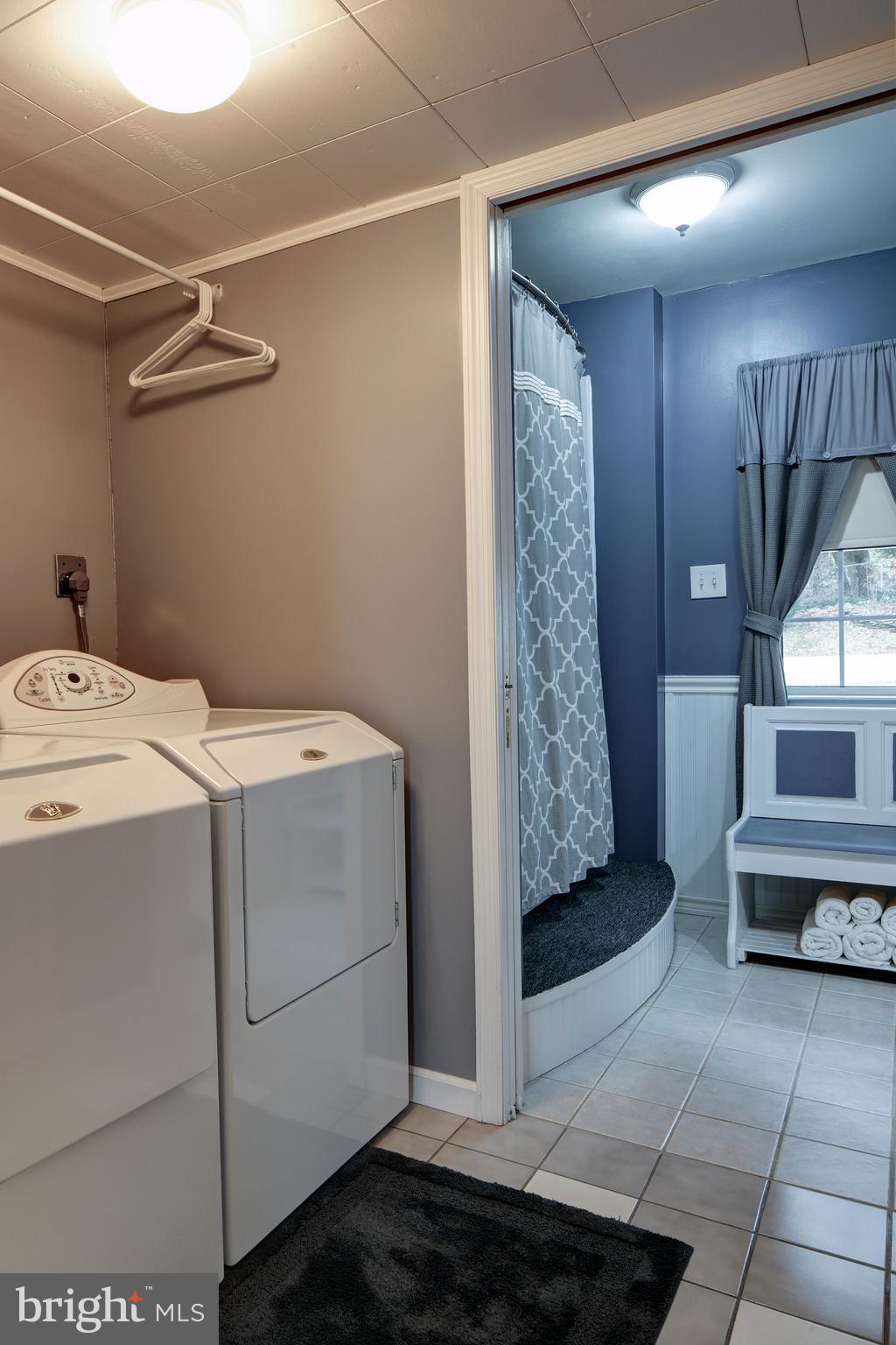 Laundry room opens to full bath