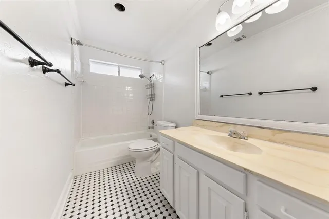 a bathroom with a sink a toilet a shower and a mirror