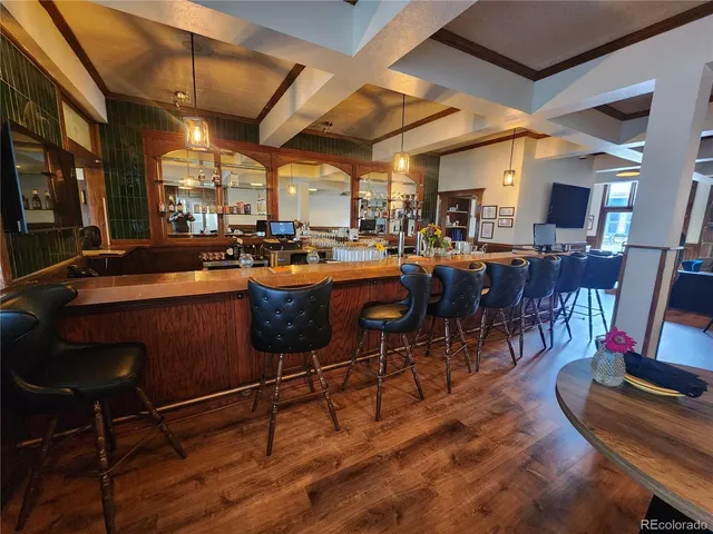 a view of a dining room with furniture window and outside view