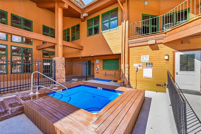 a view of a patio with a table and chairs