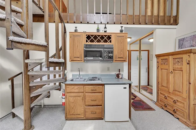 a kitchen with stainless steel appliances granite countertop a stove and a refrigerator