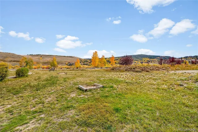 a view of a house with pool and sitting area