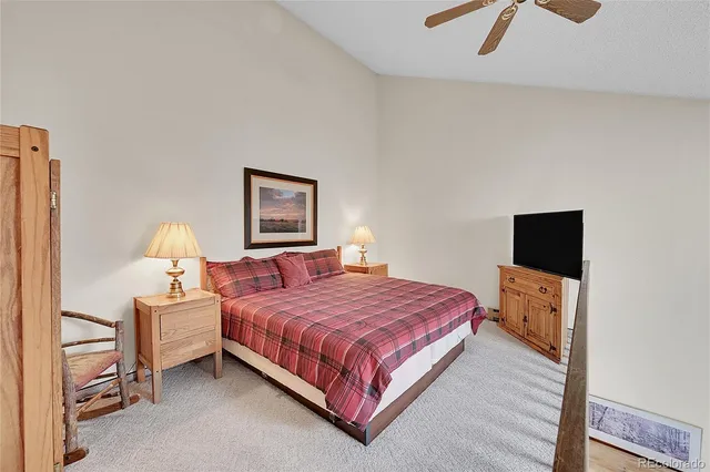 a bedroom with a bed and a night stand