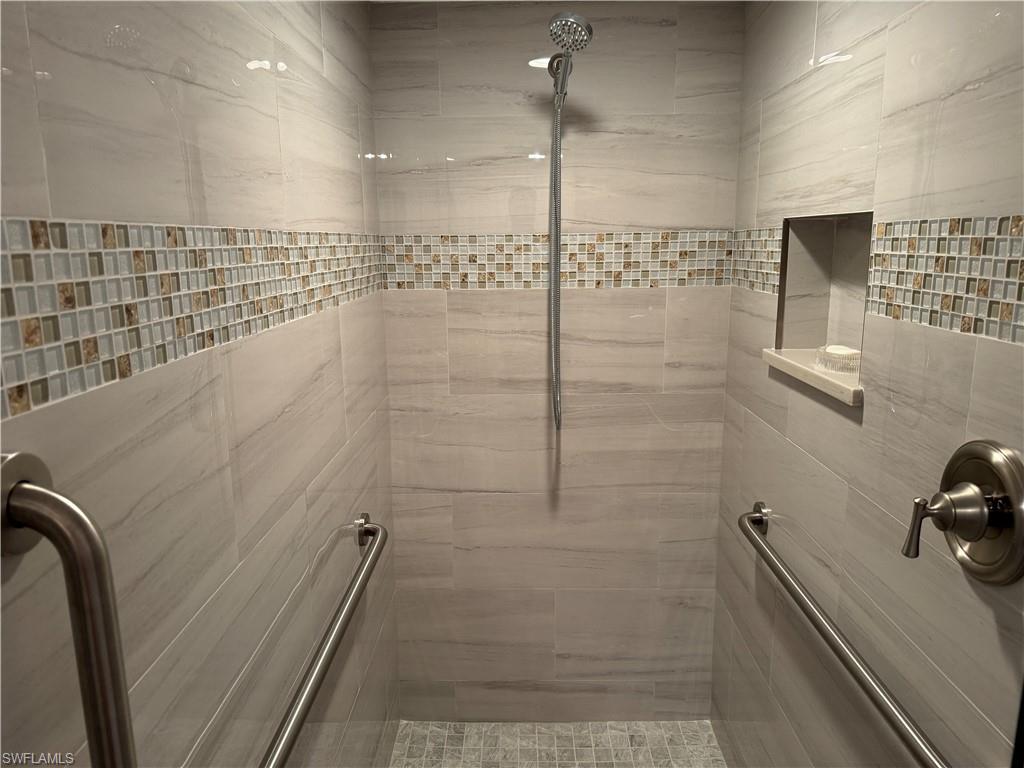 6573 Marissa Loop, Unit 902 Naples, FL 34108 - Photo 11 of 26 a bathroom with a shower