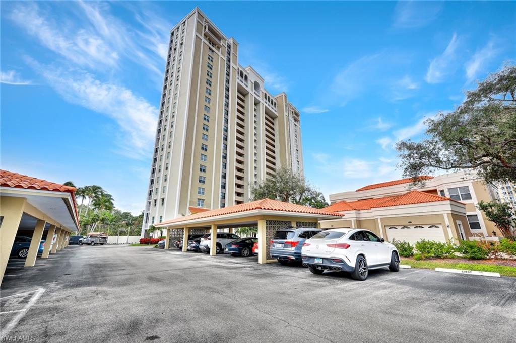 6573 Marissa Loop, Unit 902 Naples, FL 34108 - Photo 25 of 26 a car parked in front of a building