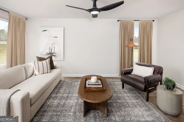 a living room with furniture and a mirror