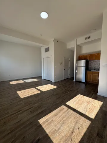 wooden floor in a hall with an entryway