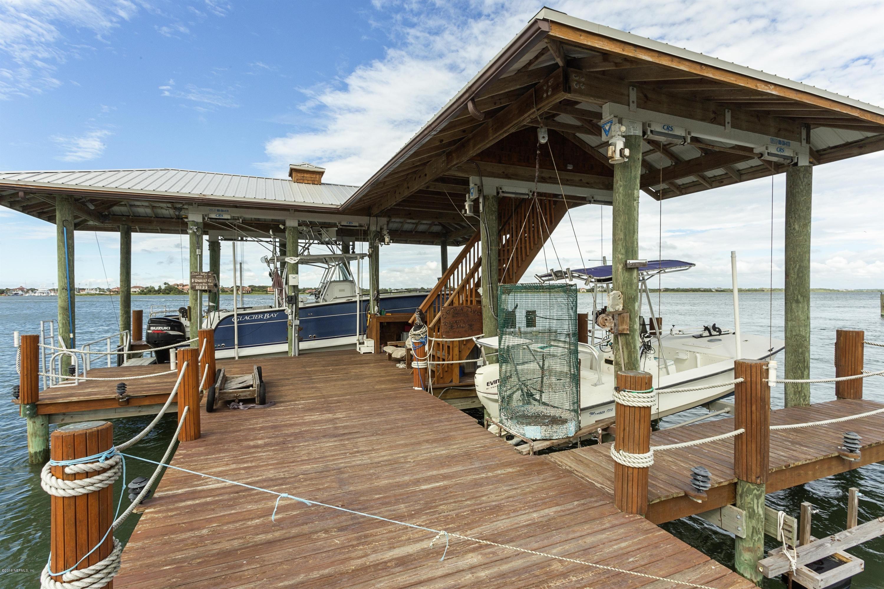 249 Rivershore Lane St. Augustine, FL 32084 - Photo 11 of 22 a view of a patio with a table and chairs