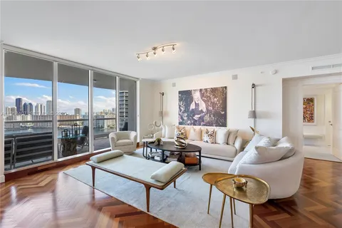 a kitchen with stainless steel appliances granite countertop a stove refrigerator and cabinets