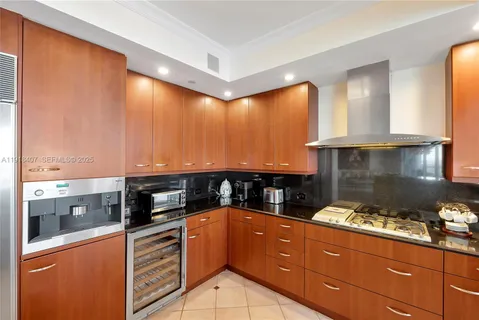 a large bedroom with two beds and painting on the wall