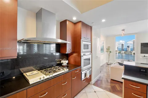 a view of a city from a balcony with furniture