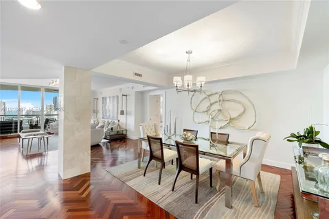 a bathroom with a granite countertop sink mirror vanity and toilet
