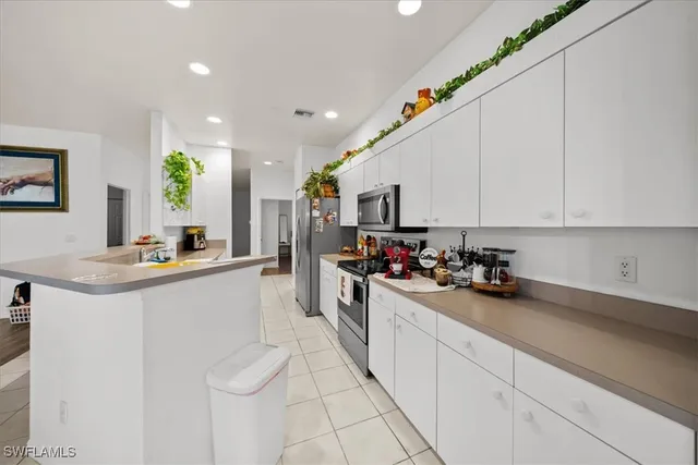 a kitchen with sink cabinets and window
