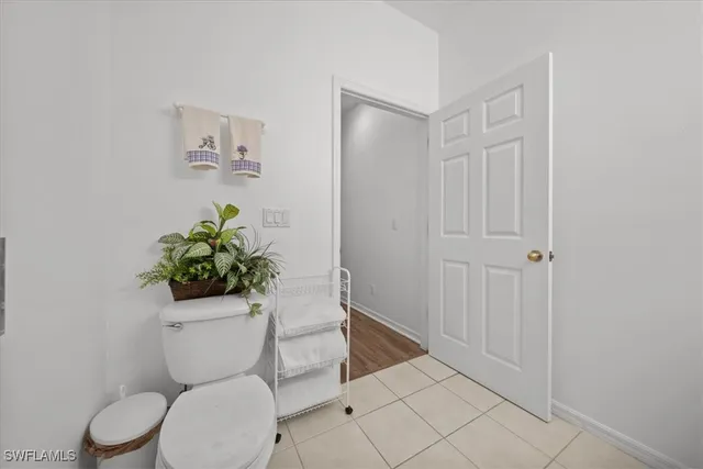 a white toilet sitting next to a bathroom sink