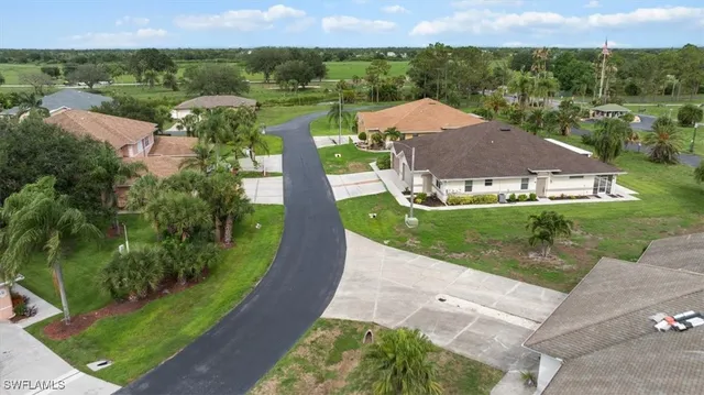 an aerial view of a house with garden space and outdoor seating