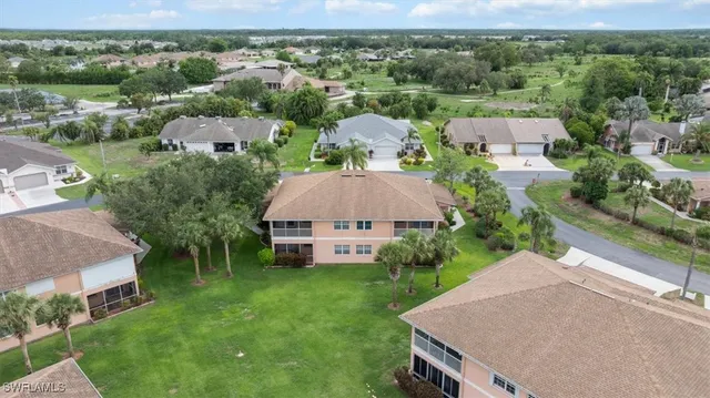 an aerial view of a house with garden space and street view