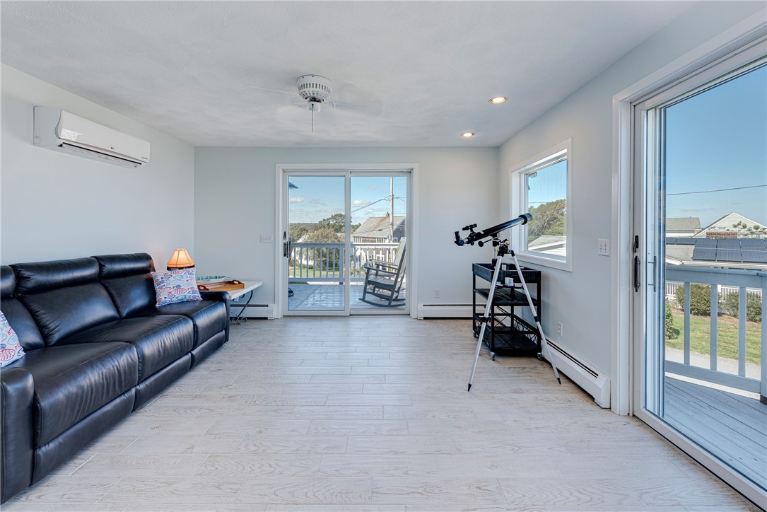 145 Colonel John Gardner Road Narragansett, RI 02882 - Photo 21 of 47 2nd Floor Family Room w/2 decks & amazing views