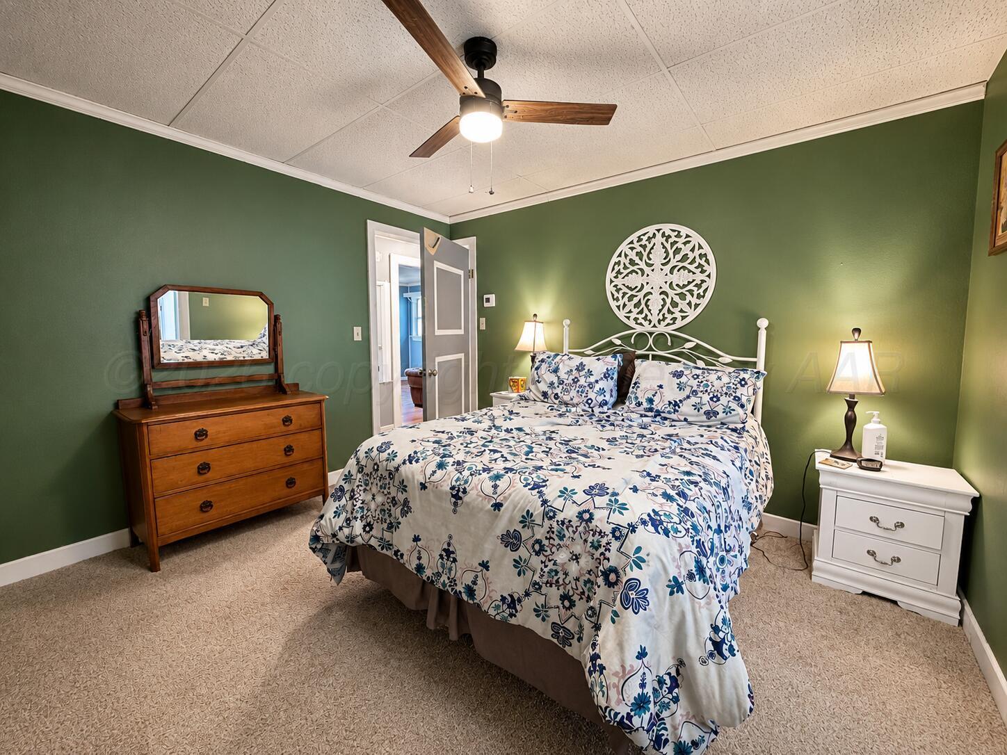 606 South Prospect Street Amarillo, TX 79106 - Photo 15 of 22 a bedroom with a bed and a table