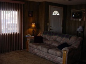 112 Howington Boulevard Seligman, AZ 86337 - Photo 3 of 6 a living room with furniture and a large window