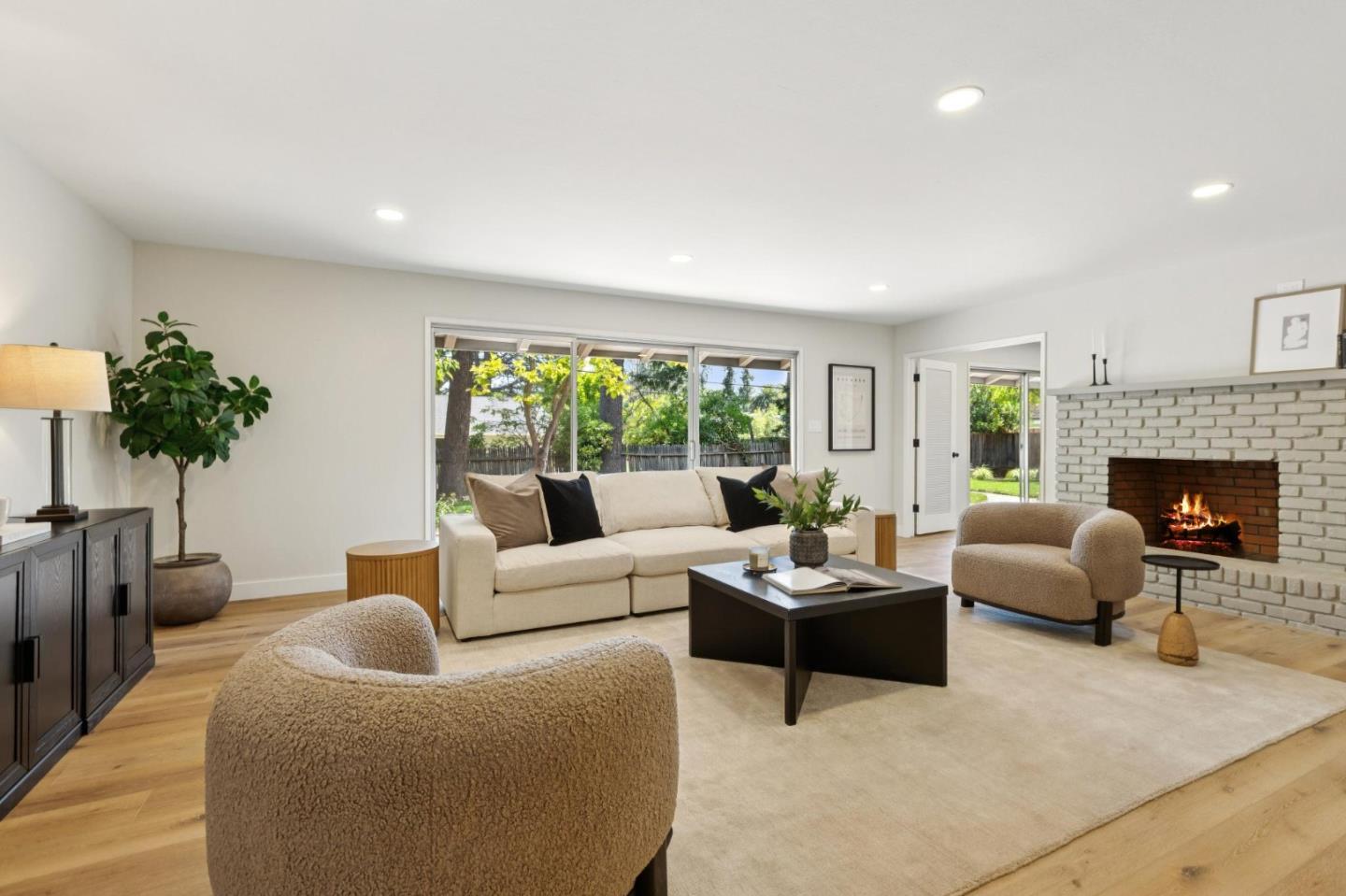 755 Santa Rita Avenue Los Altos, CA 94022 - Photo 10 of 50 a living room with furniture a potted plant and a fireplace