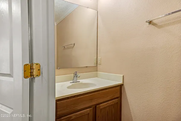 an empty room with wooden floor and window