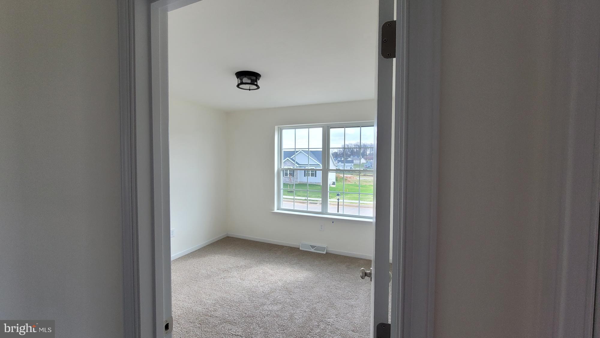 3 Kinzer's Court, Unit 70 Hanover, PA 17331 - Photo 11 of 22 a view of an empty room with a window