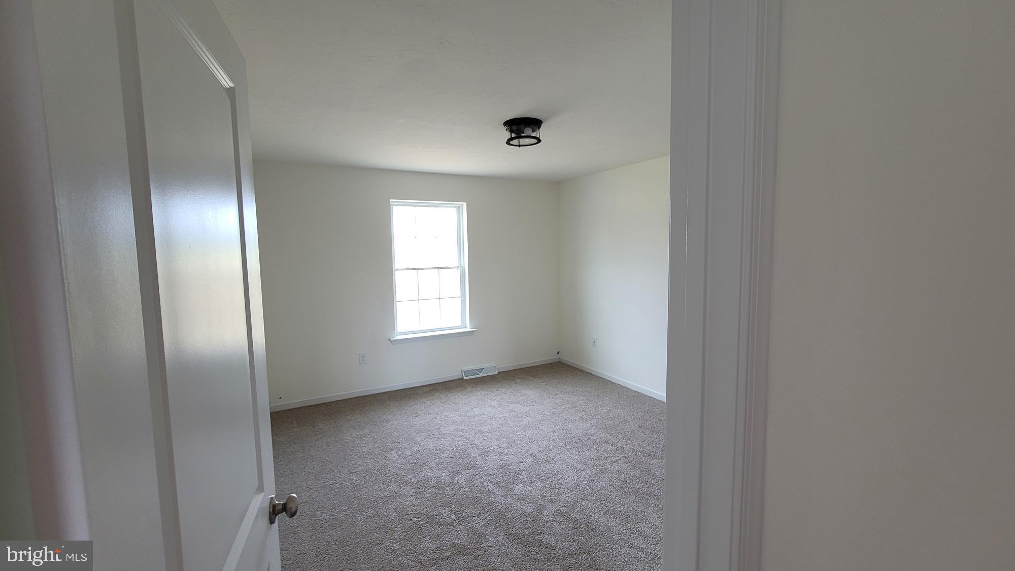 3 Kinzer's Court, Unit 70 Hanover, PA 17331 - Photo 15 of 22 an empty room with windows and closet