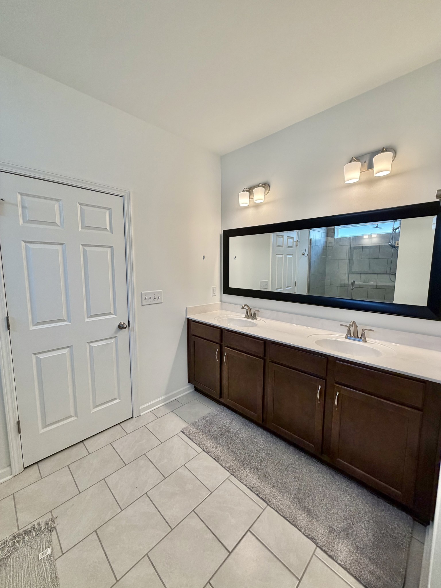 4918 Turquoise Lane Murfreesboro, TN 37129 - Photo 11 of 18 a spacious bathroom with a double vanity sink and mirror