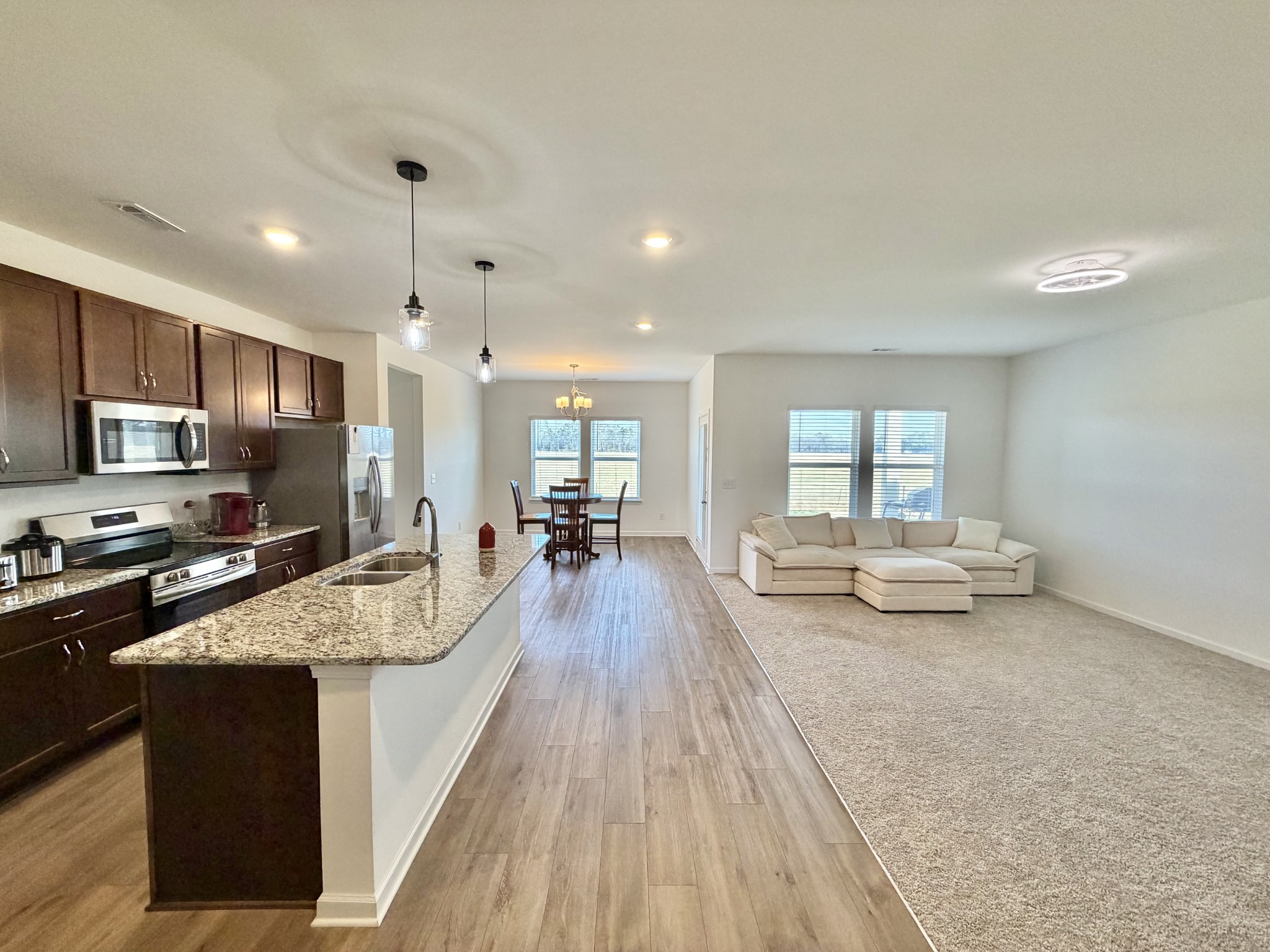 4918 Turquoise Lane Murfreesboro, TN 37129 - Photo 5 of 18 a large white kitchen with sink stove and refrigerator