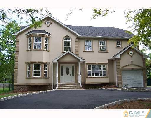 1117 New Dover Road Edison, NJ 08820 - Photo 1 of 8 a front view of a house with a garden