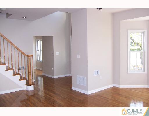 1117 New Dover Road Edison, NJ 08820 - Photo 2 of 8 a view interior of a house with wooden floor and windows