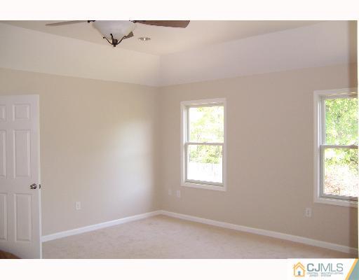 1117 New Dover Road Edison, NJ 08820 - Photo 6 of 8 a view of an empty room with a window