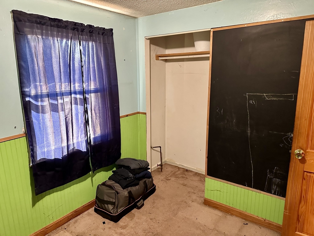14 Dennis Lane Wareham, MA 02571 - Photo 26 of 33 a living room with a bed furniture and a window