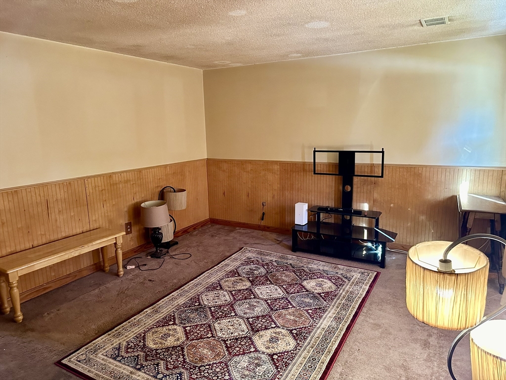 14 Dennis Lane Wareham, MA 02571 - Photo 4 of 33 a living room with a rug and a couch
