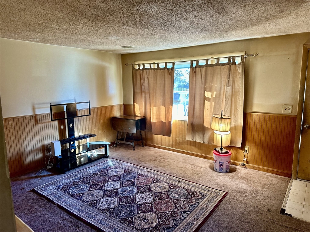 14 Dennis Lane Wareham, MA 02571 - Photo 6 of 33 a living room with a couch and a rug