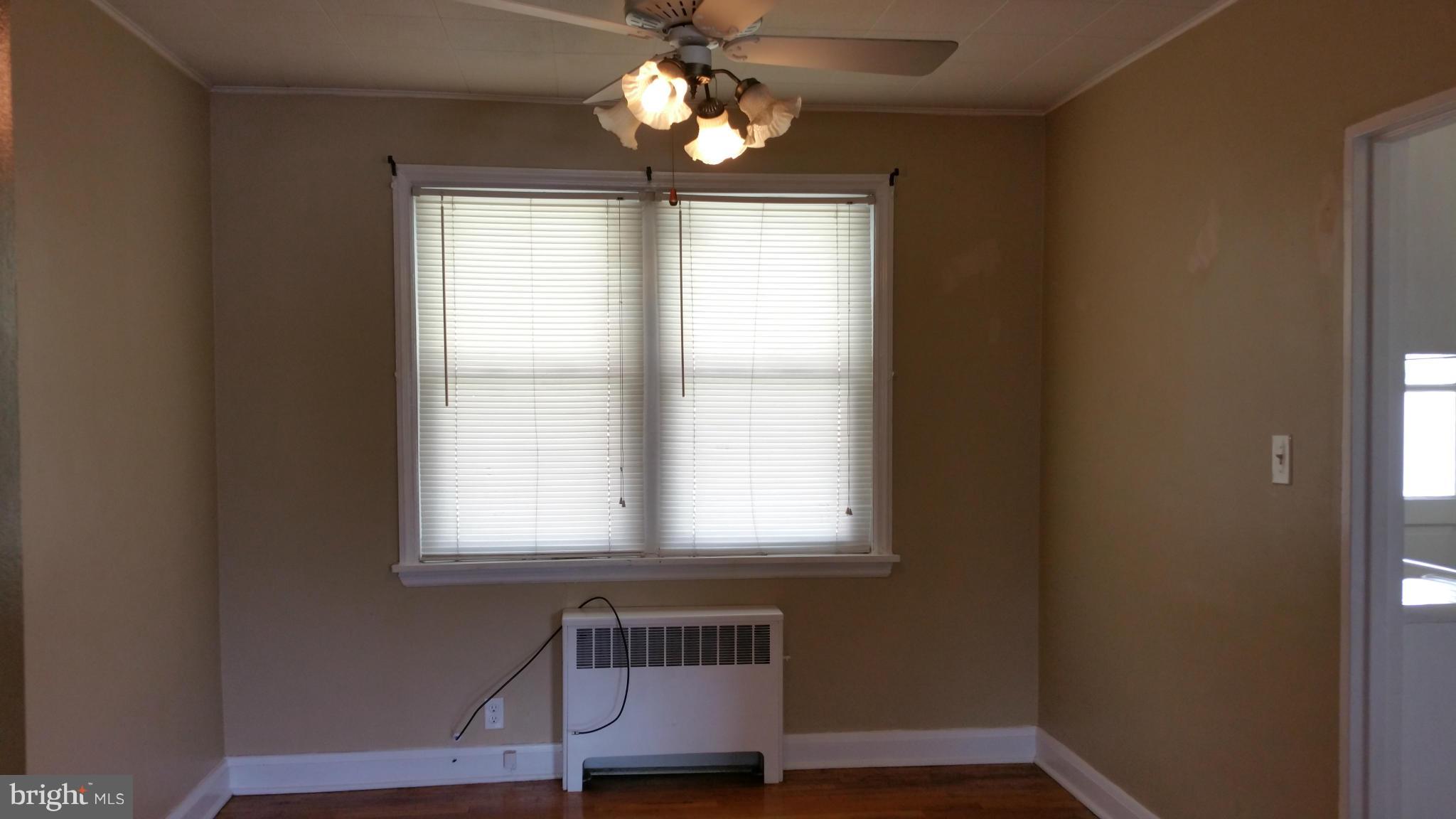 3902 Colchester Road Baltimore, MD 21229 - Photo 12 of 27 a room with wooden floor and windows