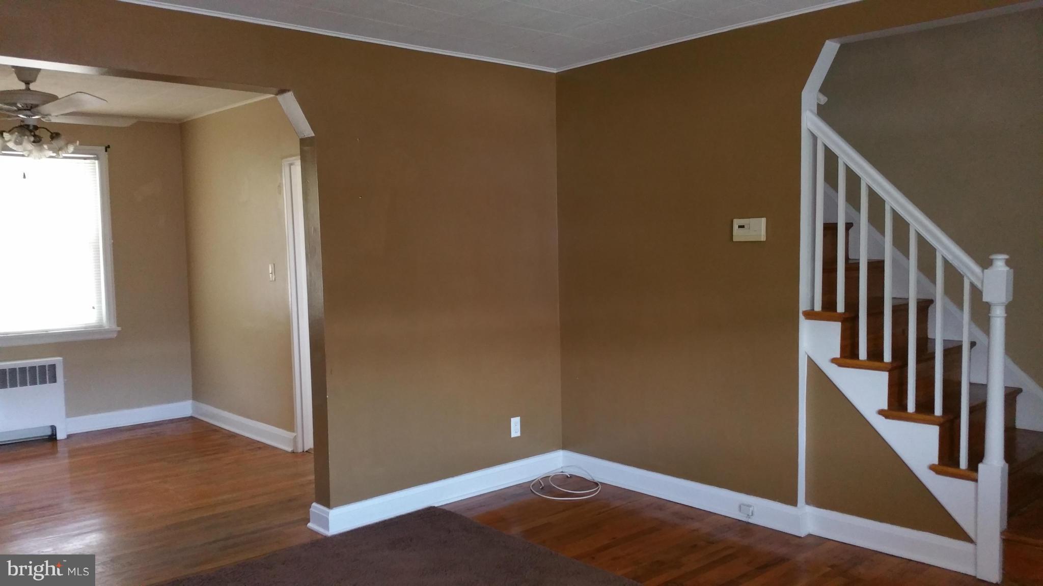 3902 Colchester Road Baltimore, MD 21229 - Photo 26 of 27 a view of a hallway with wooden floor