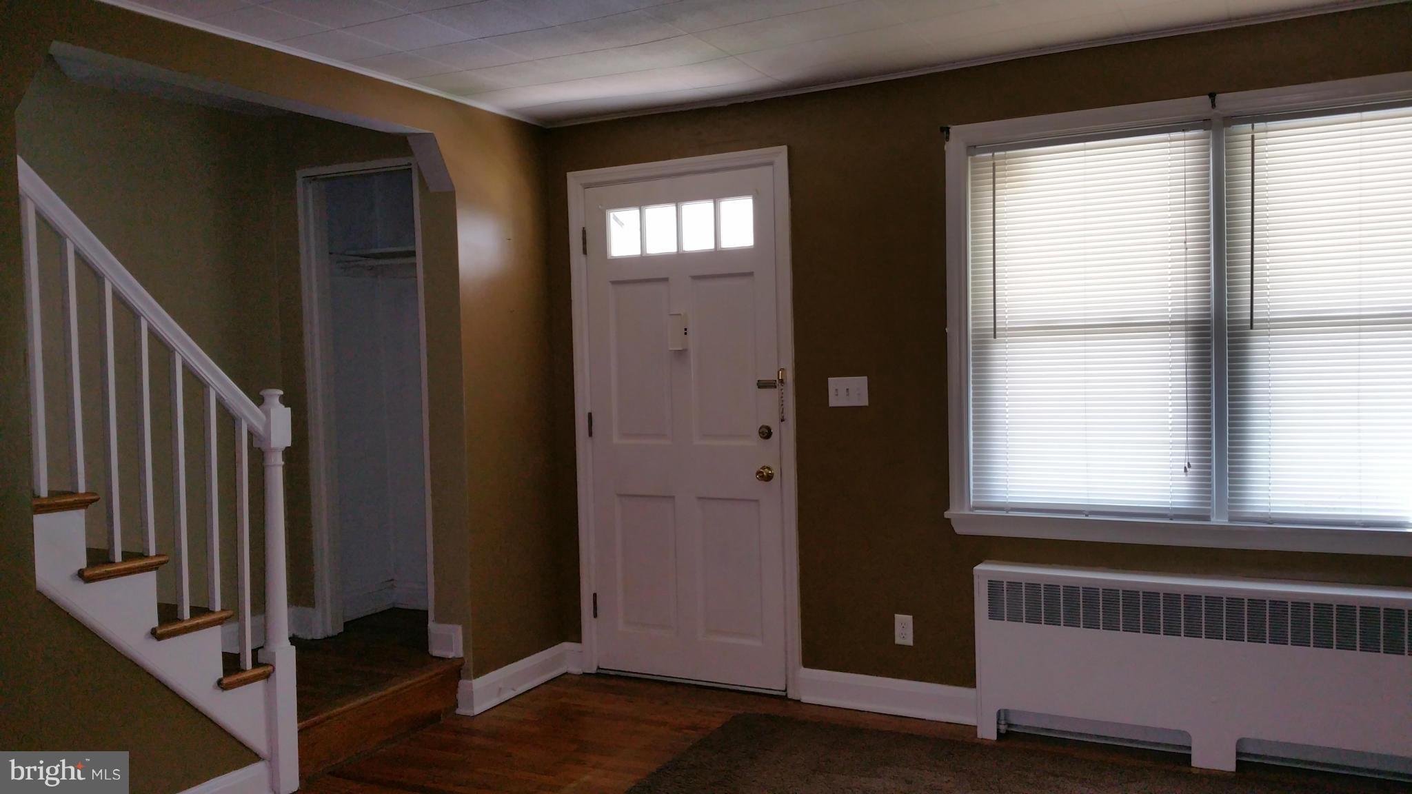 3902 Colchester Road Baltimore, MD 21229 - Photo 27 of 27 a view of an empty room with wooden floor and a window
