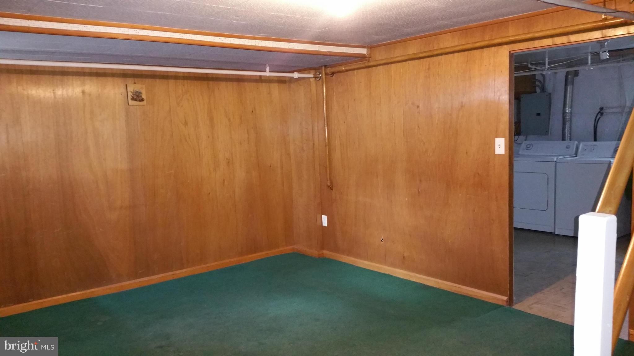 3902 Colchester Road Baltimore, MD 21229 - Photo 4 of 27 a view of a small room with wooden walls