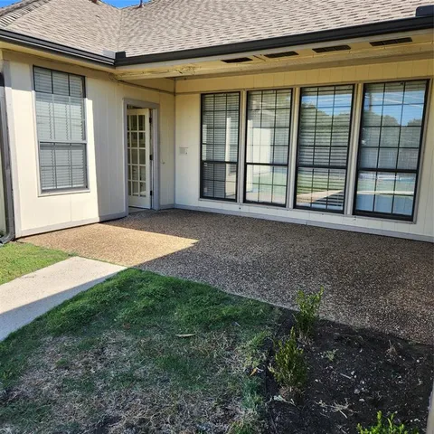 a view of front door of a house with a yard