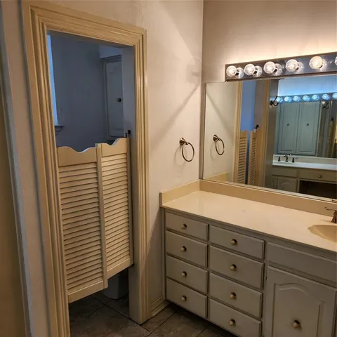 a bathroom with a sink and mirror