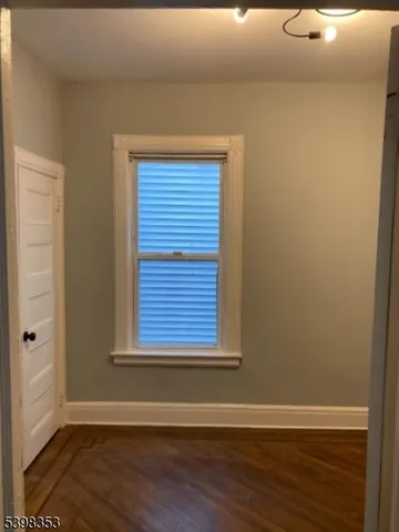 a view of a livingroom with wooden floor
