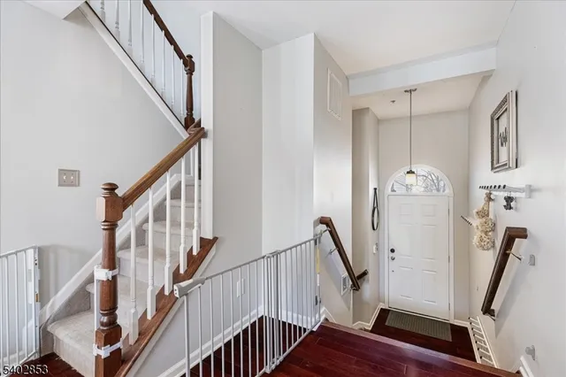 a view of an entryway with wooden floor