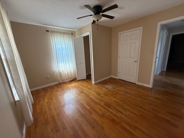 302 West Ward Street Energy, IL 62933 - Photo 15 of 37 wooden floor in an empty room with a window