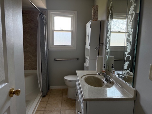 302 West Ward Street Energy, IL 62933 - Photo 17 of 37 a bathroom with a sink a toilet and a mirror
