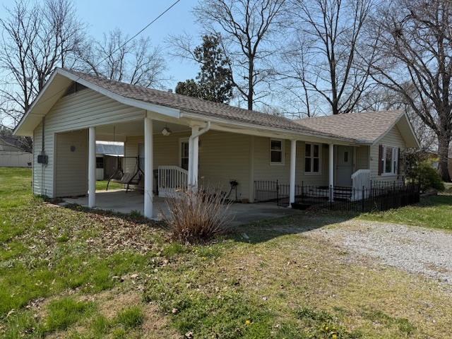 302 West Ward Street Energy, IL 62933 - Photo 2 of 37 a front view of house with yard and trees in the background