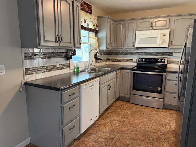 302 West Ward Street Energy, IL 62933 - Photo 8 of 37 a kitchen with stainless steel appliances granite countertop a sink stove and refrigerator