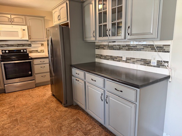 302 West Ward Street Energy, IL 62933 - Photo 9 of 37 a kitchen with stainless steel appliances granite countertop a refrigerator and a stove top oven